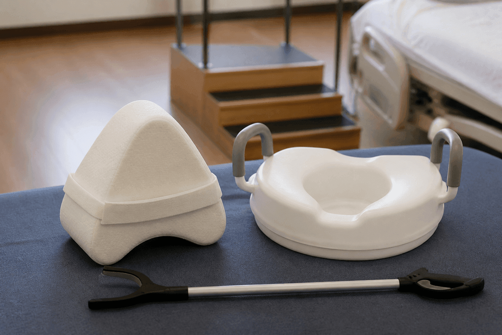 Abductor pillow and raised toilet seat in a rehab setting.
