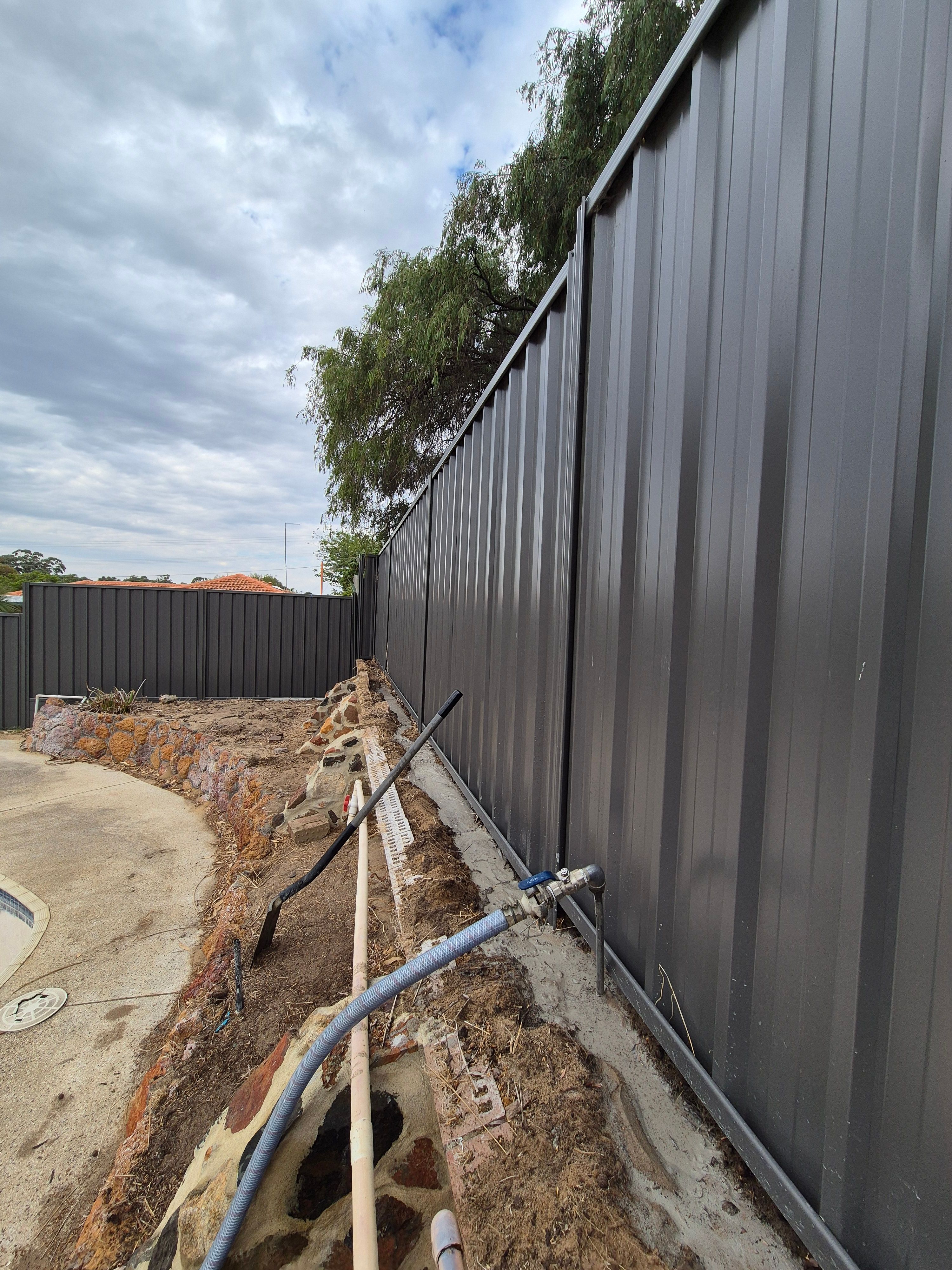 close up of newly built dark fence