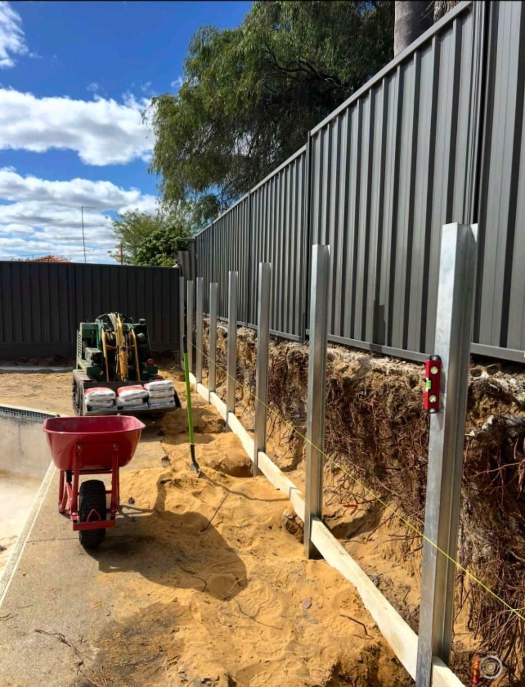 dark grey fence with posting