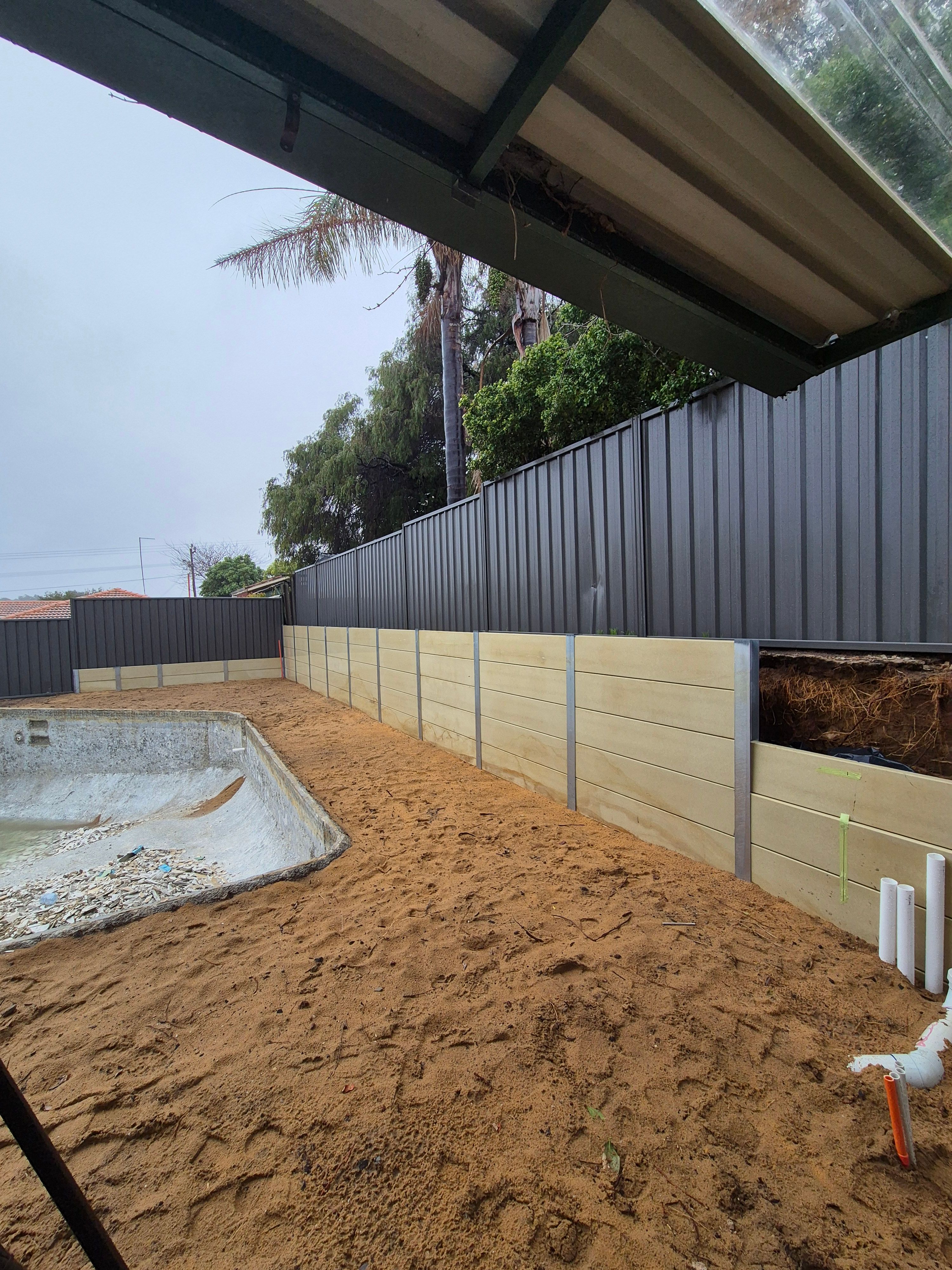 newly built dark grey fence
