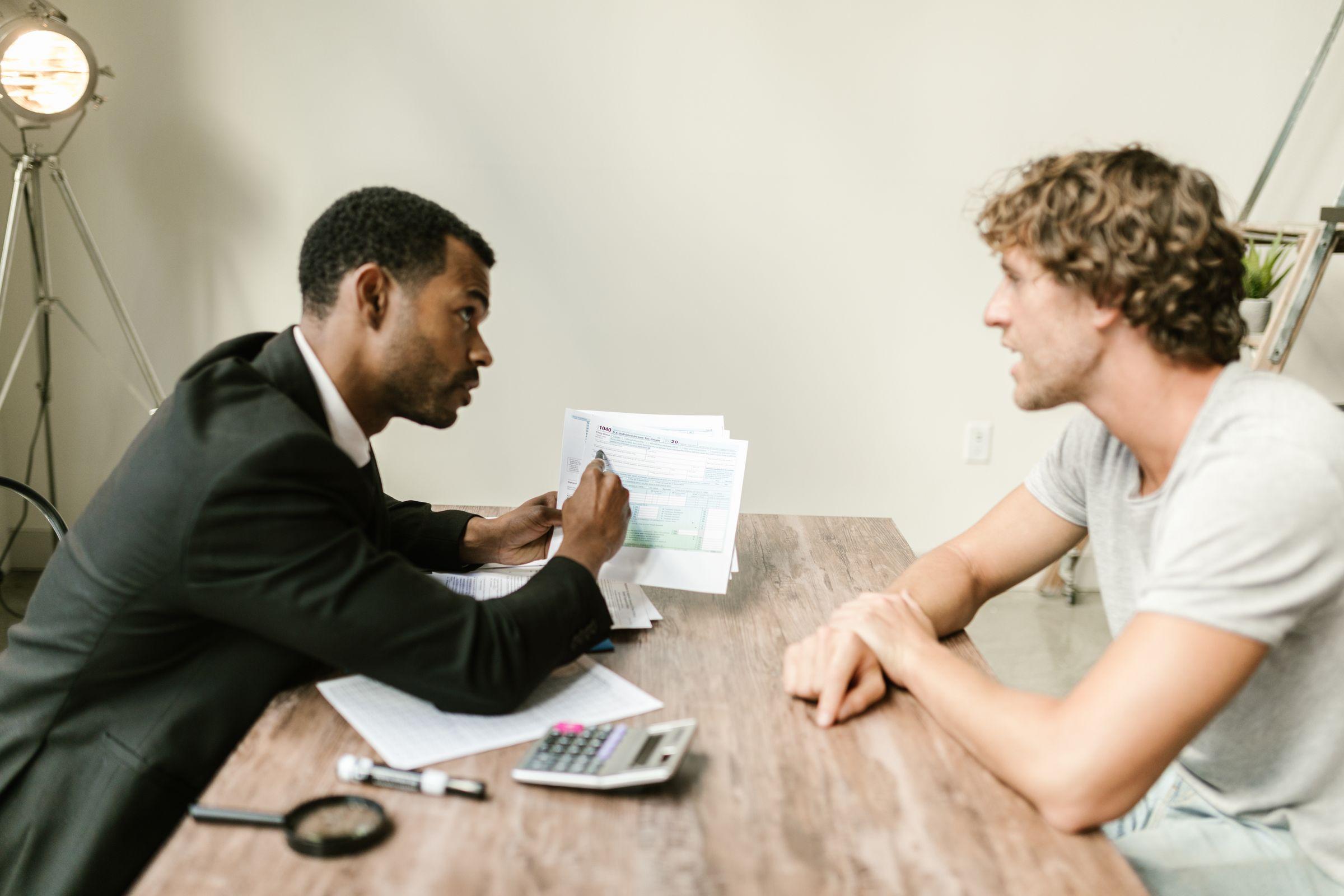A Fairway tax professional reviewing tax documents with a client