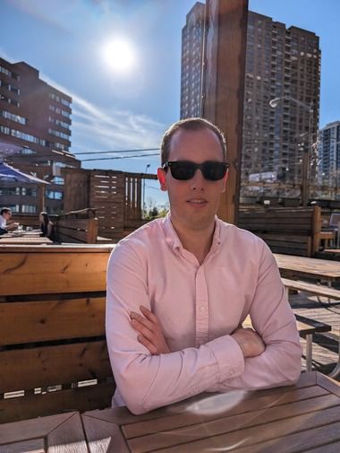 Lucas Silbernagel sitting on a rooftop patio in Toronto