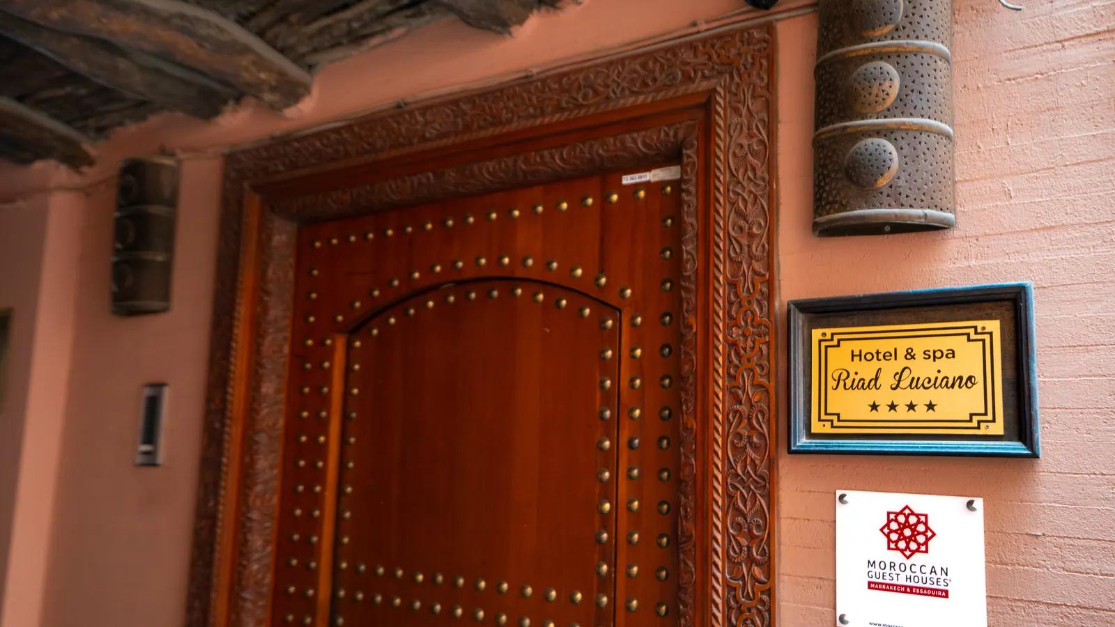 Entrance door and Riad Luciano sign in Dar El Bacha