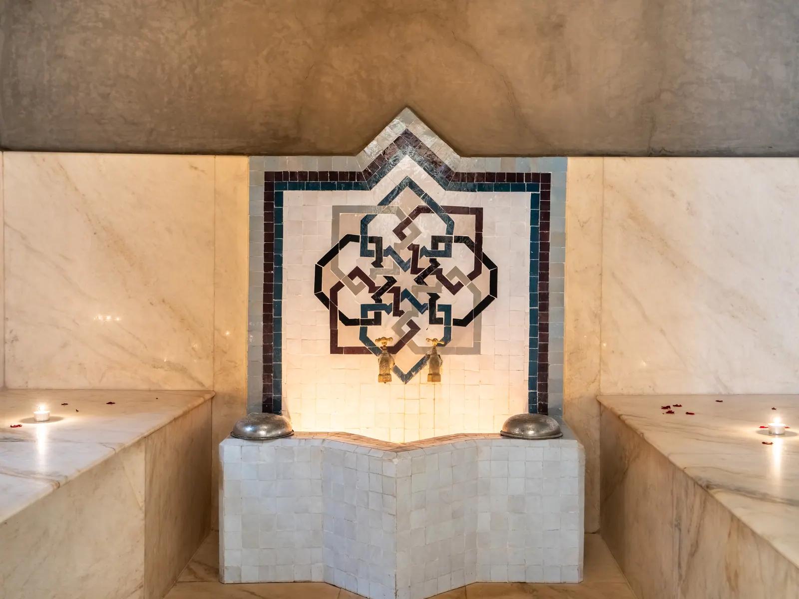 Marble fountain and Moroccan tile detail in the hammam
