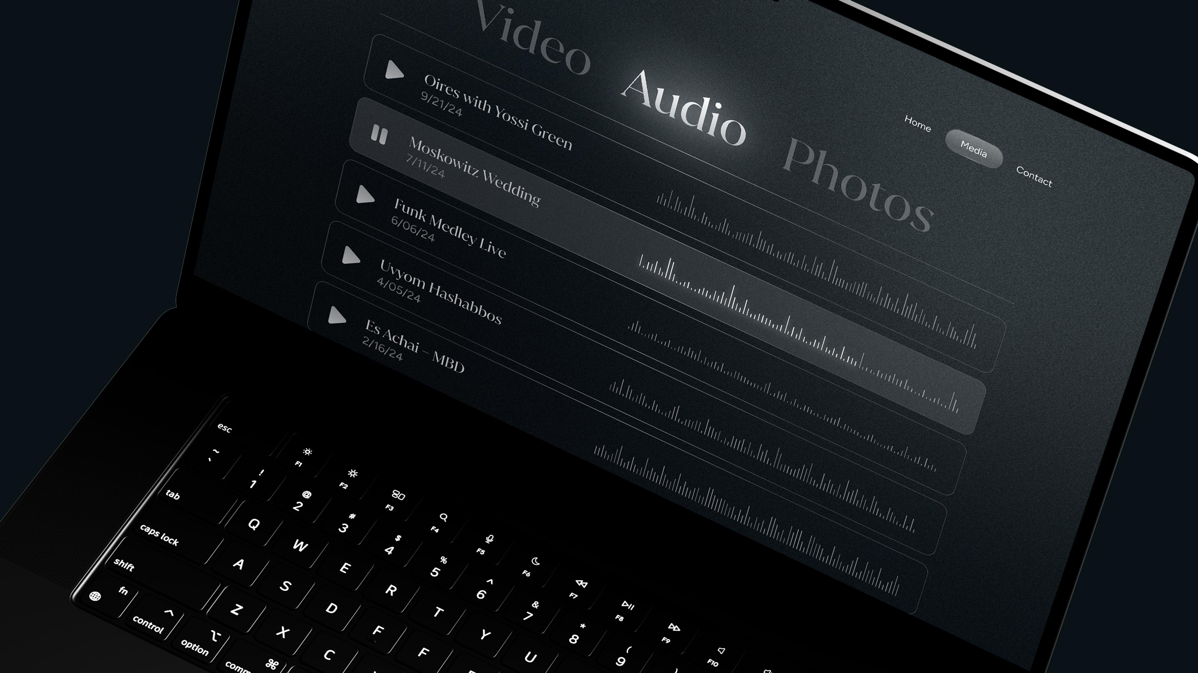 Mendy Hershkowitz Band: Audio and video playlist interface on a laptop.