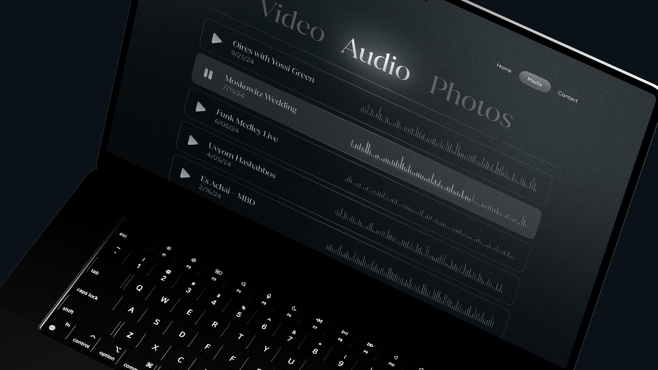 Mendy Hershkowitz Band: Audio and video playlist interface on a laptop.