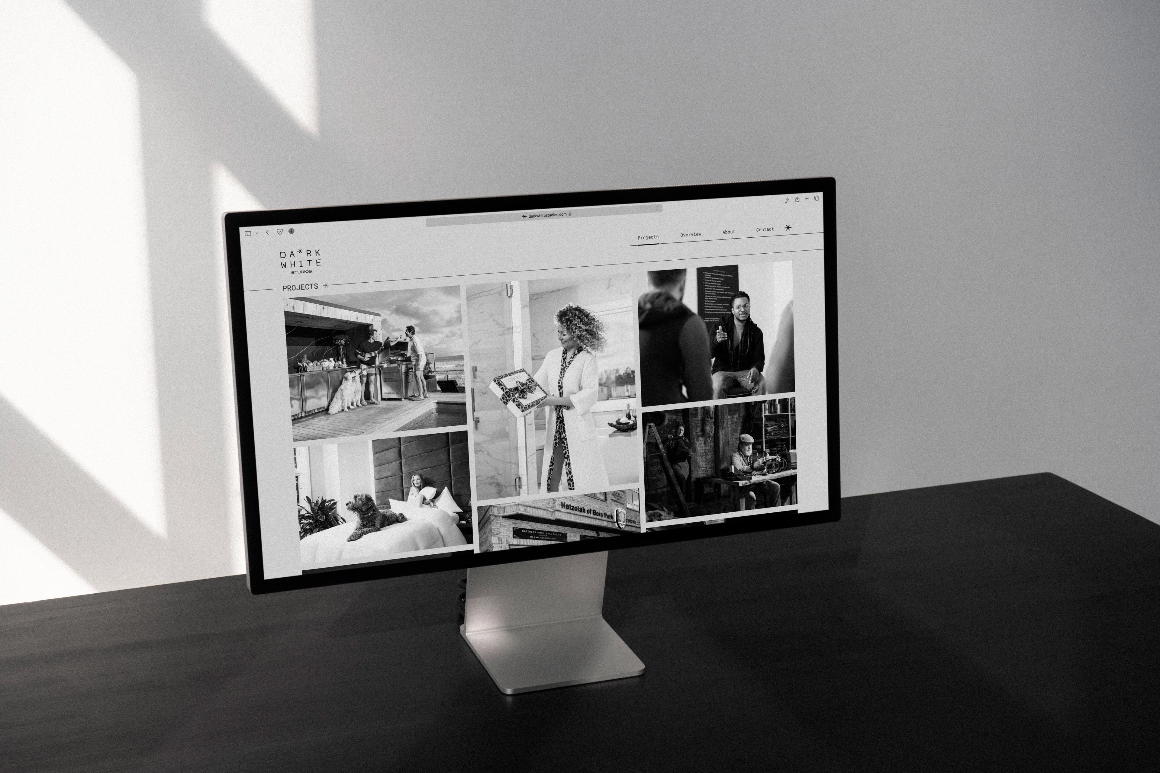 Dark White Studios: Photography portfolio displayed on a desktop monitor.