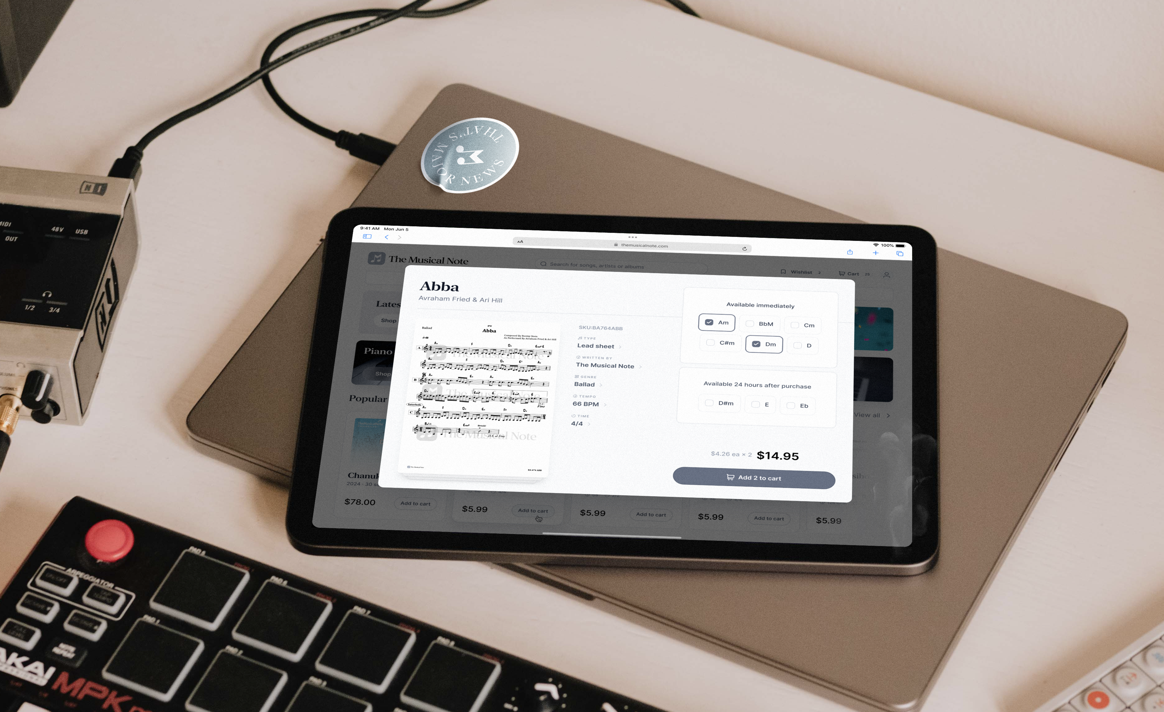 The Musical Note: Sheet music preview and purchase dialog on a tablet.