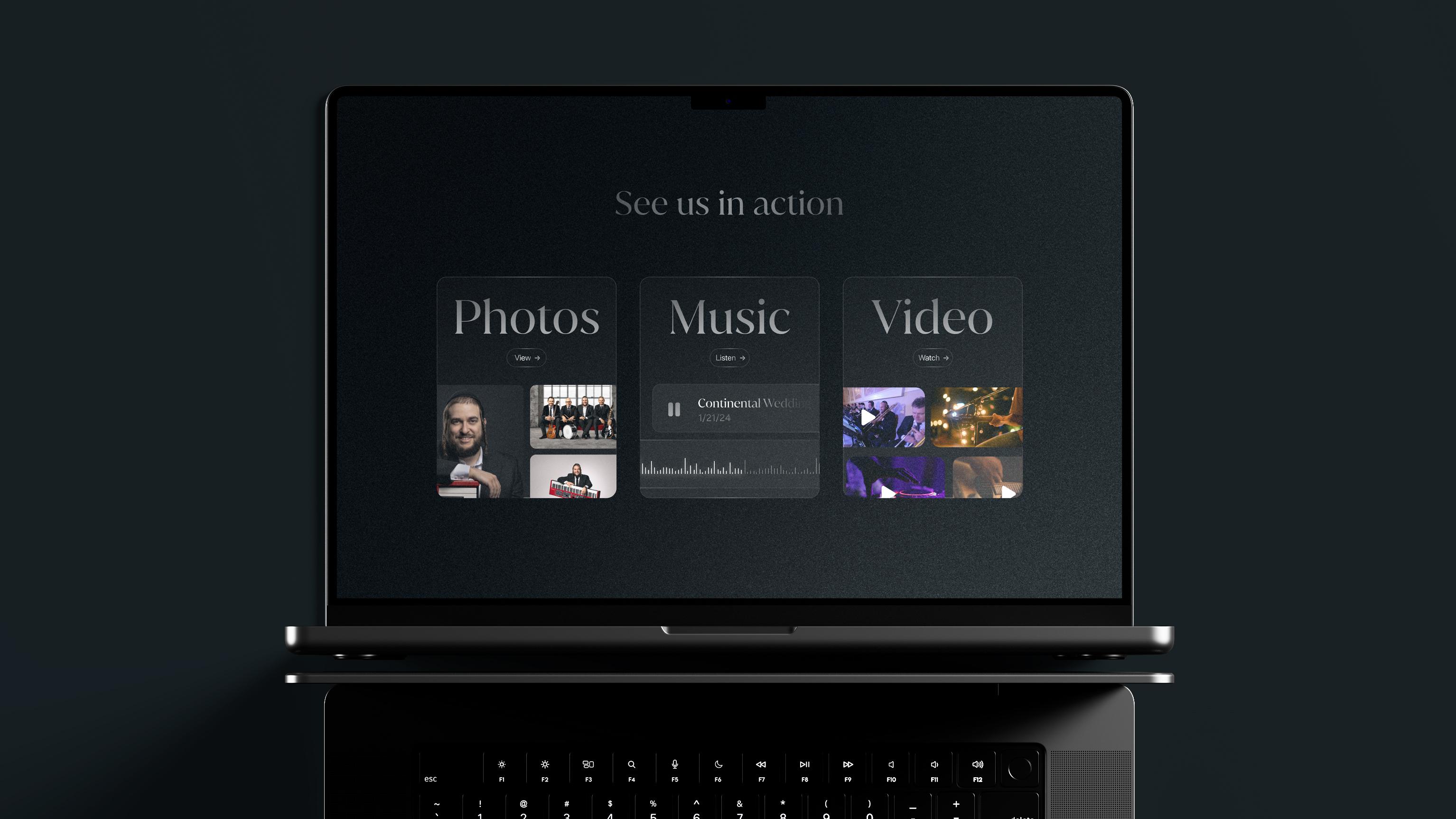 Mendy Hershkowitz Band: Photo, music, and video gallery navigation on a laptop.