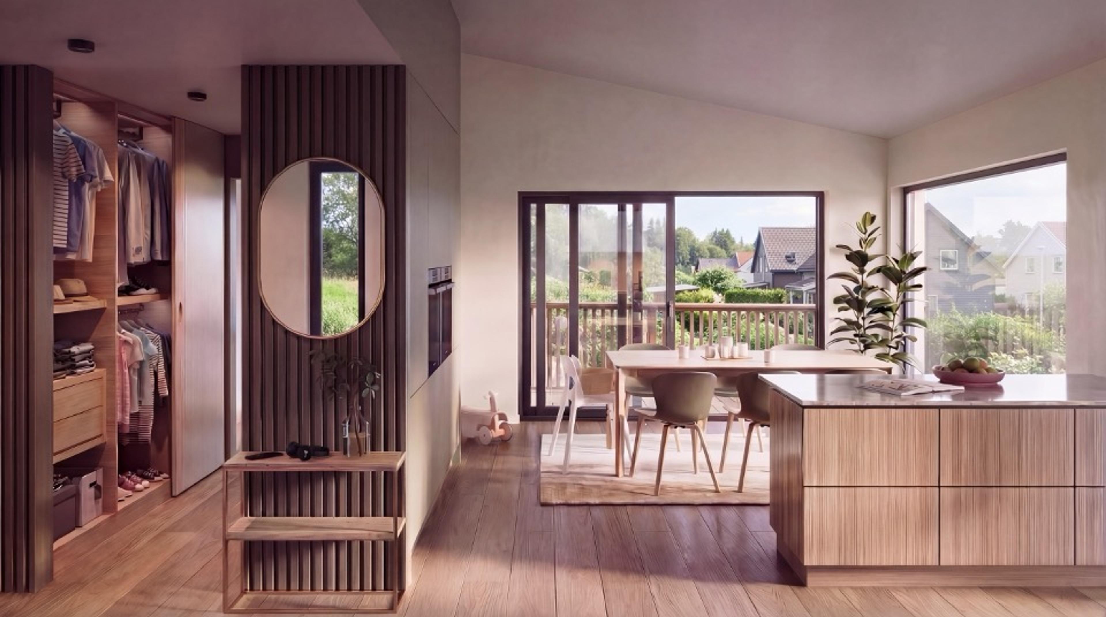 Åpen stue- og kjøkken, med en praktisk garderobevegg