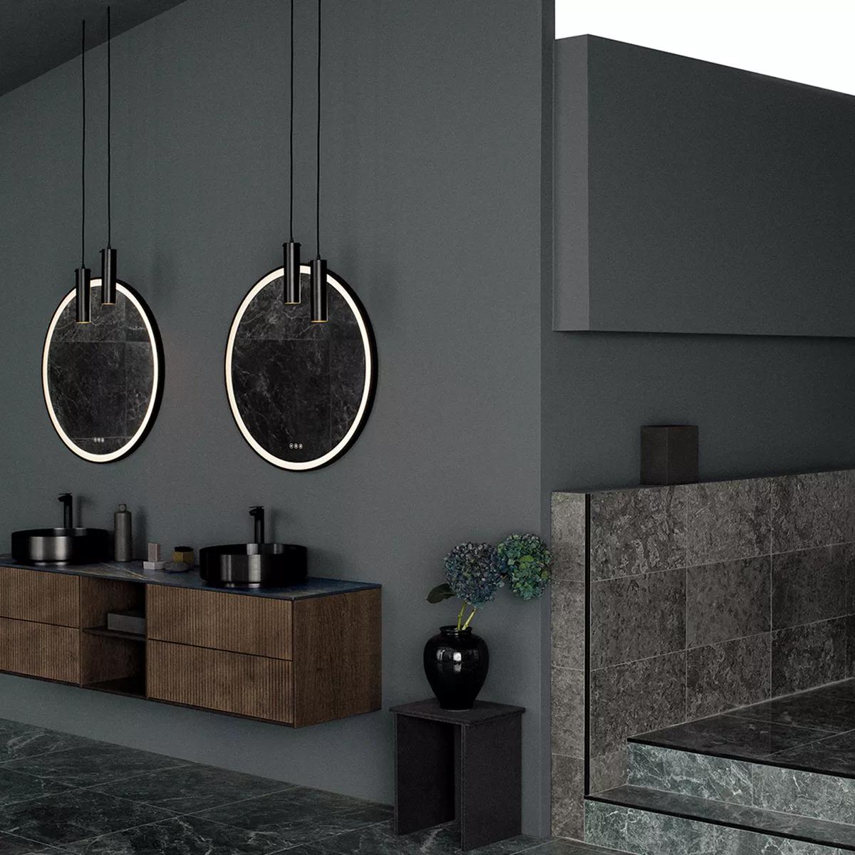 A modern, dark bathroom with two circular illuminated mirrors above black sinks and a wooden floating vanity.