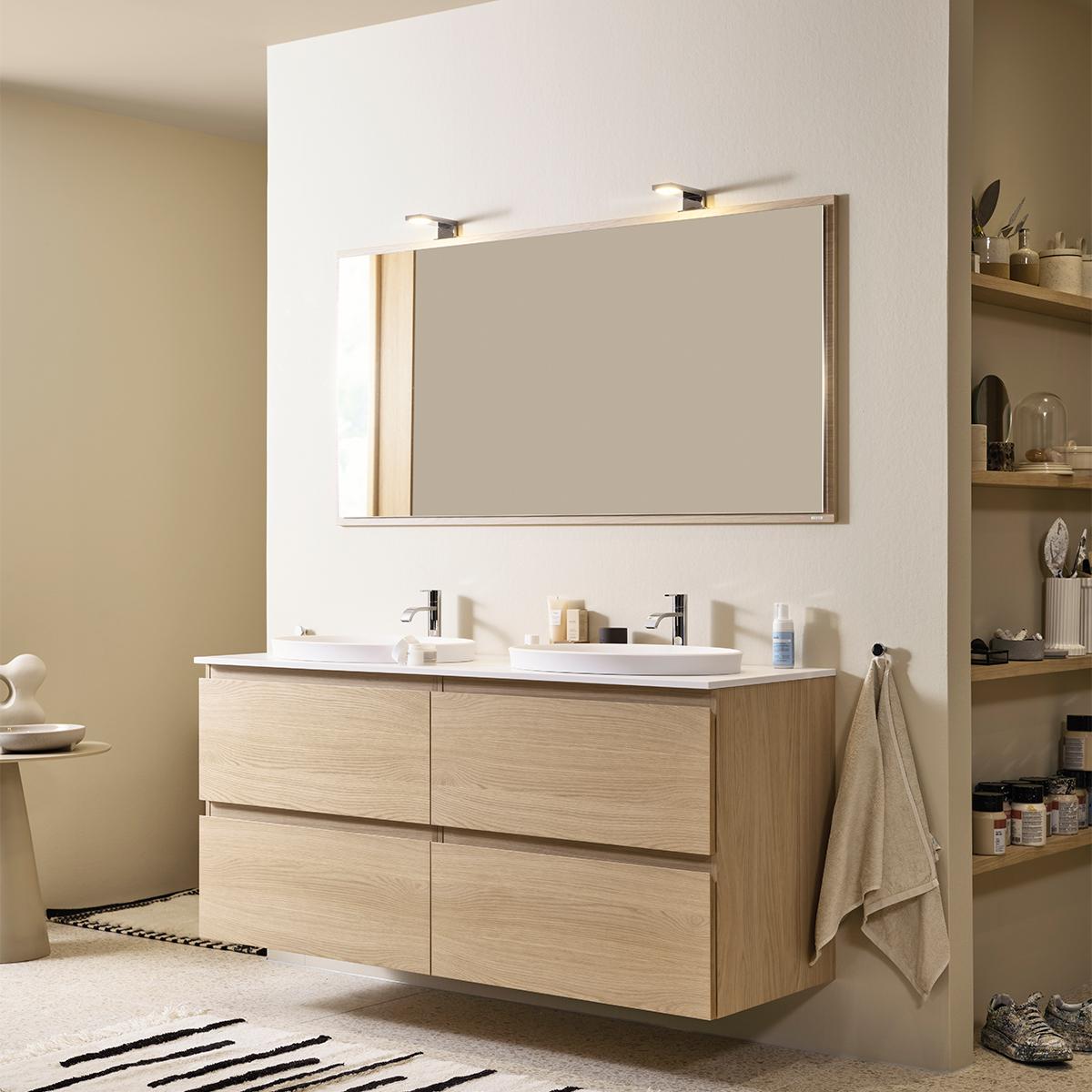 A modern bathroom featuring a light wood floating double vanity with white sinks, a large mirror above it, and open shelving to the right.