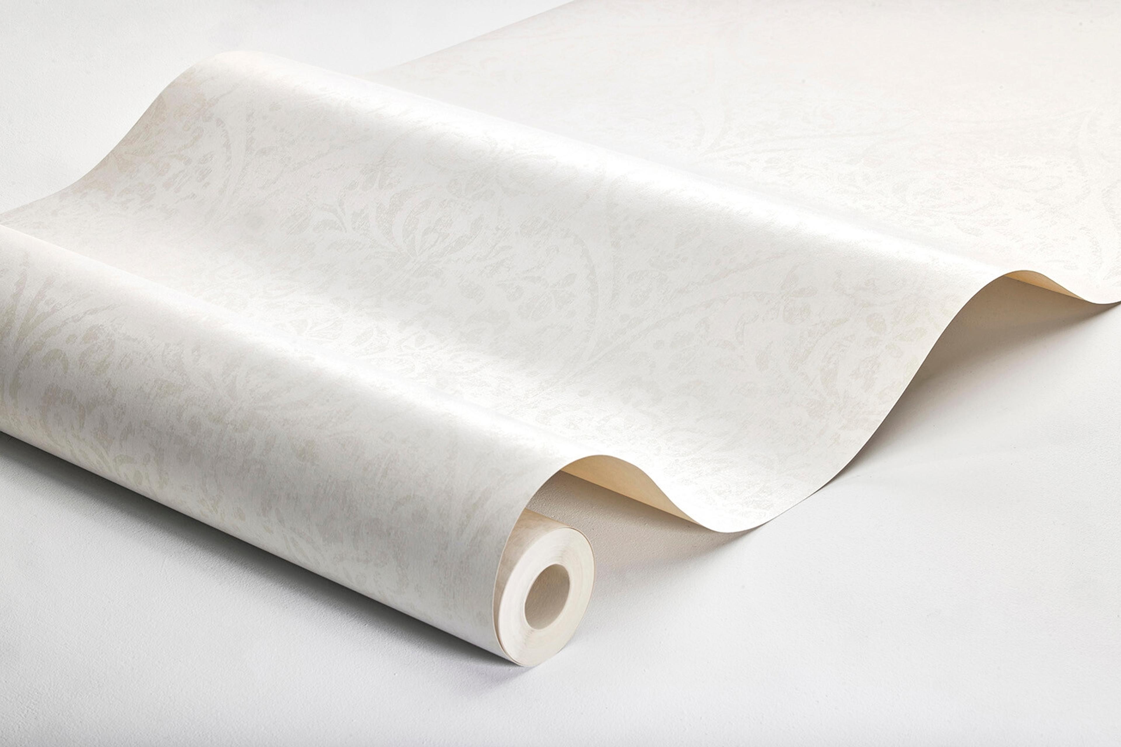 Hidden Medallion tapet tapet med medaljonger mönster i vit. Från kollektionen Dreamy Escape. Nonwoven-material med rak passning. Passar i vardagsrum och matsal.