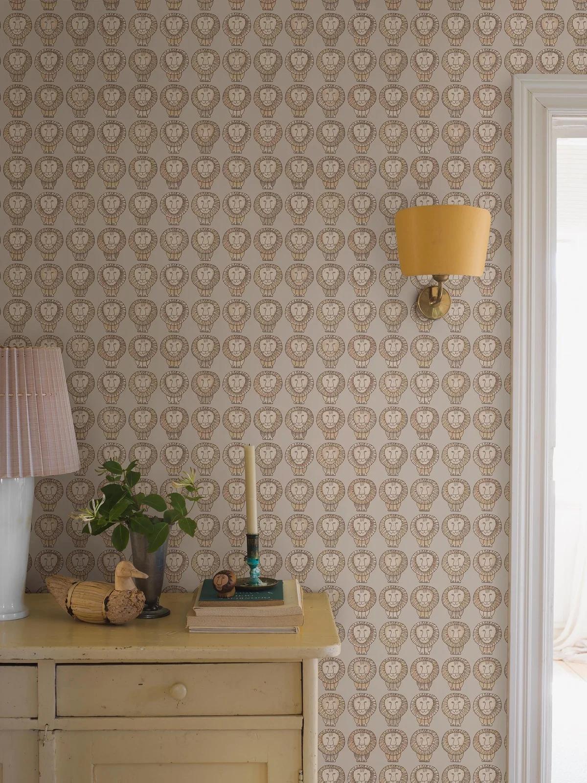 A bedroom features blue wallpaper with a pattern of white daisies with orange centers, a white floating nightstand with flowers, and a bed.