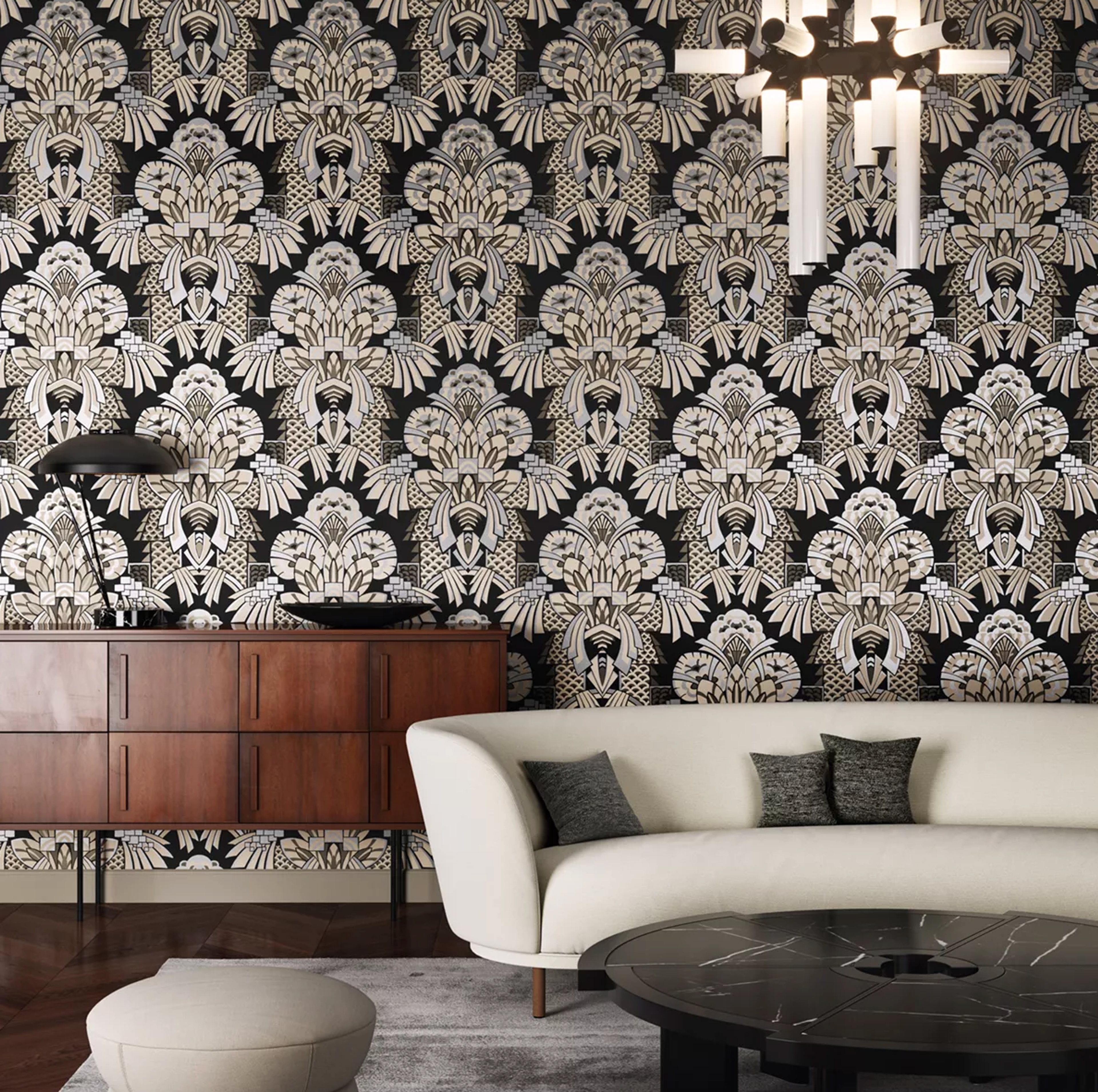Black, white, and gold Art Deco pattern wallpaper in a living room with a white sofa and wooden credenza.