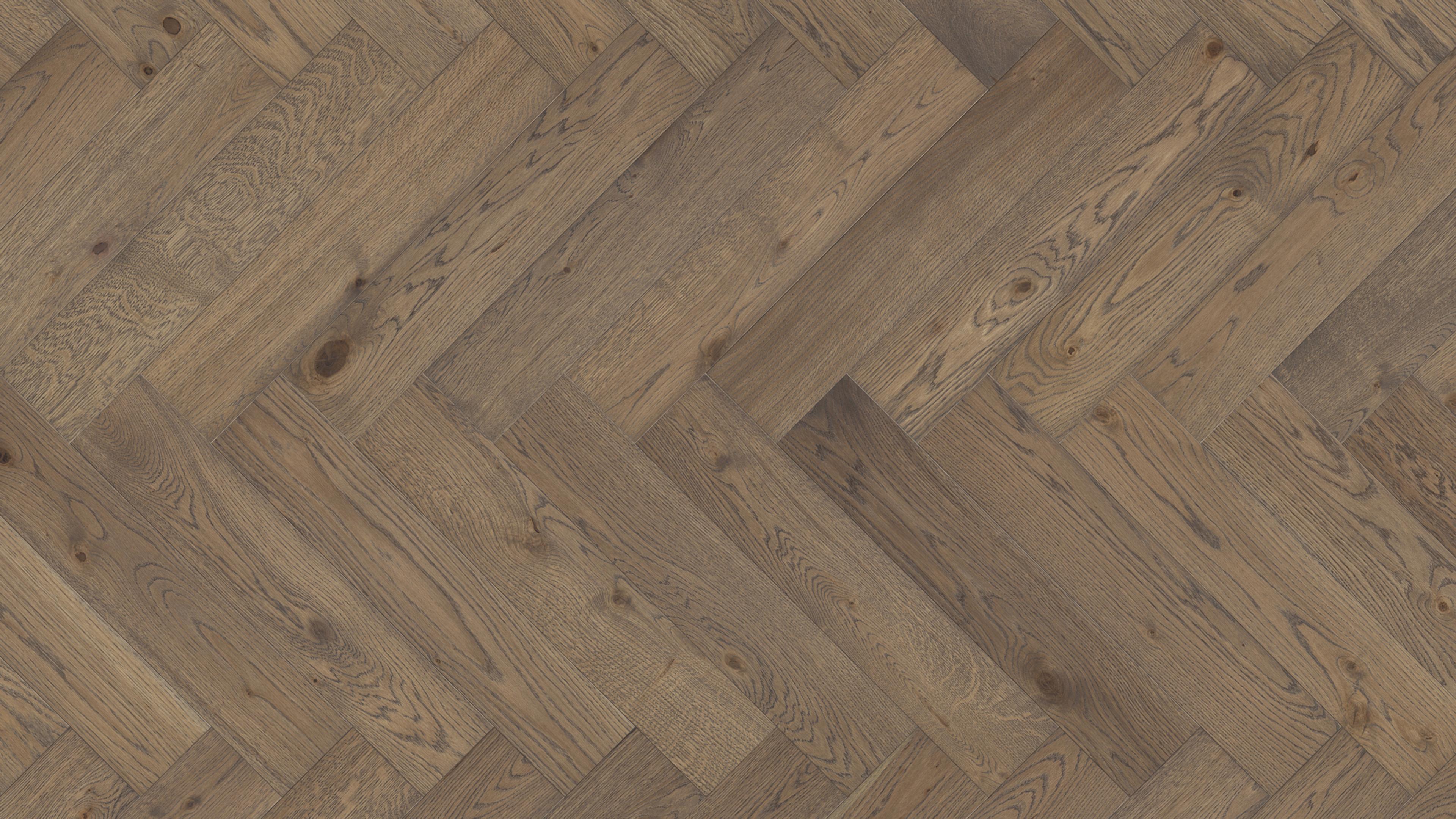 Medium brown wood flooring in a herringbone pattern.