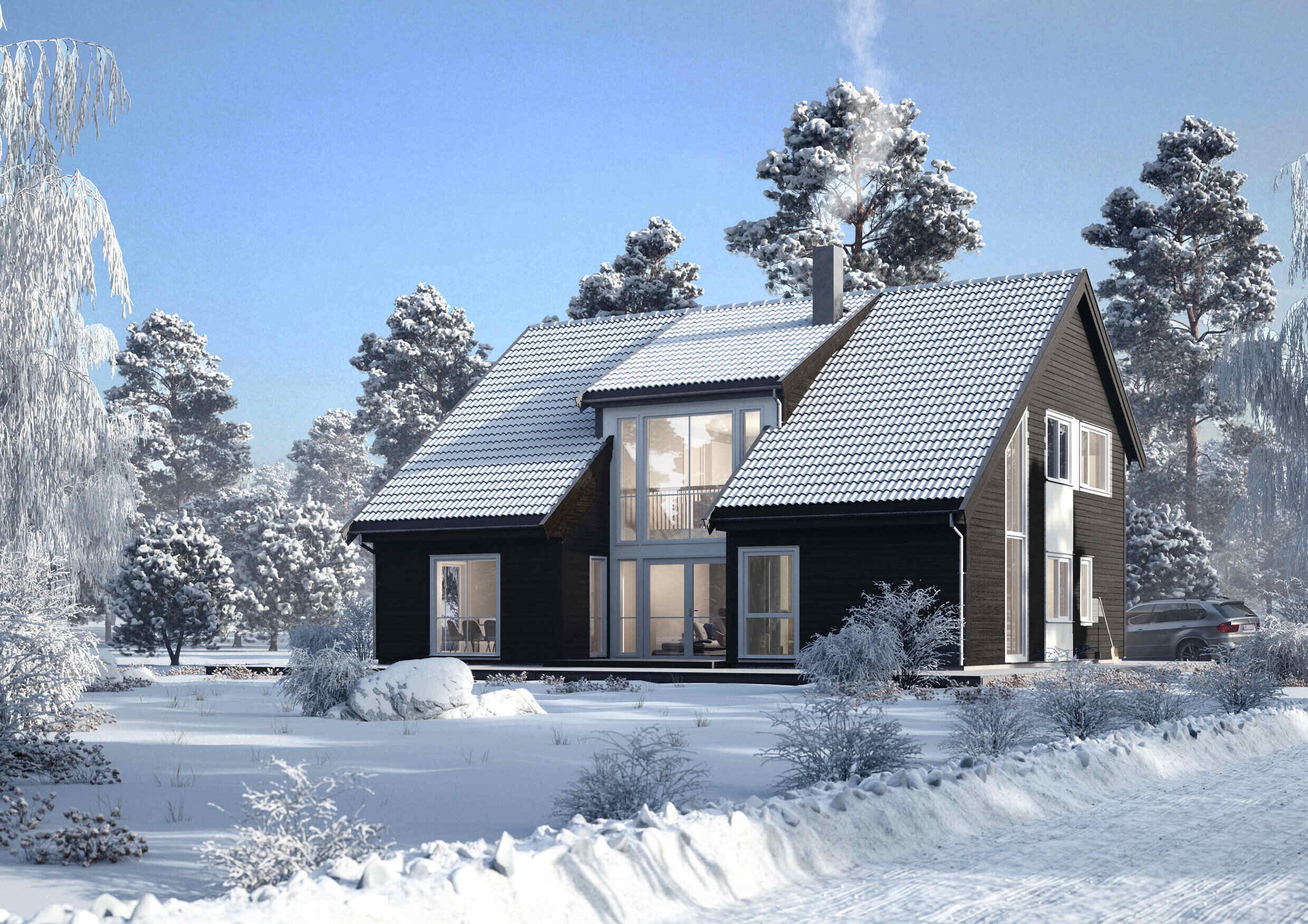 Et svart hus med skråtak over to etasjer i vinterlandskap