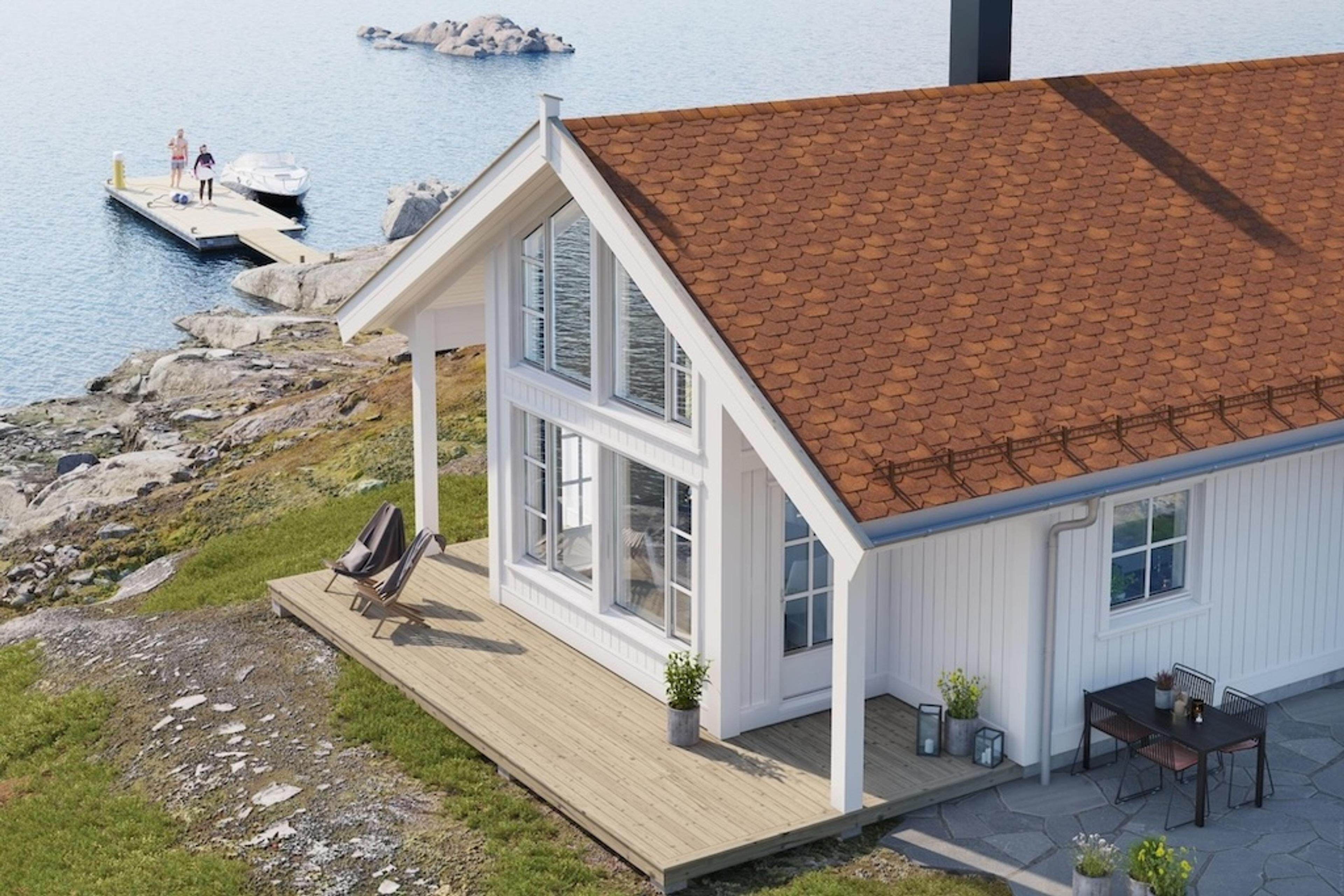 Hvit hytte ved sjøen med rød takshingel fra Isola