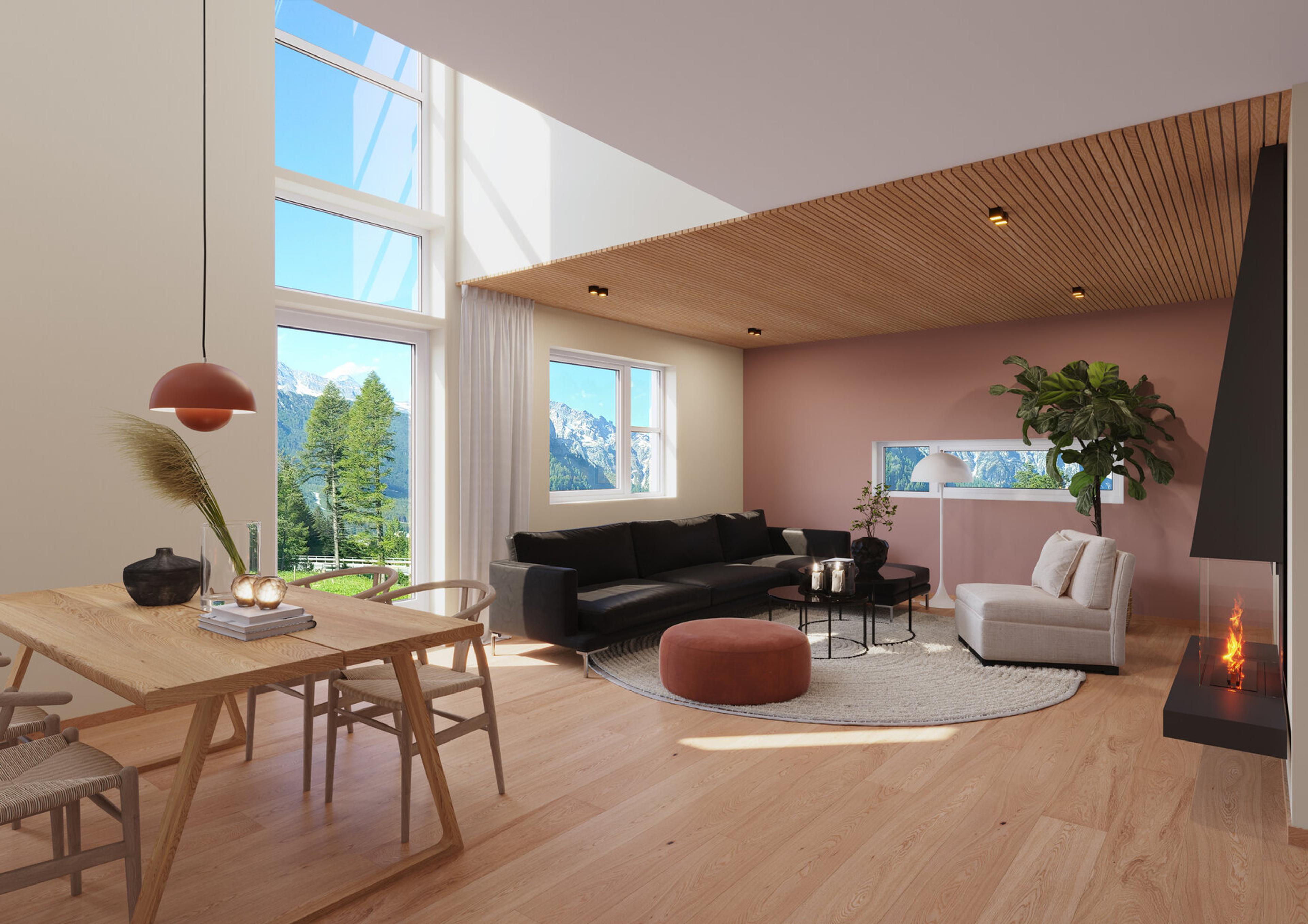En stue med sort sofa, rosa vegg og spisebord i eik 