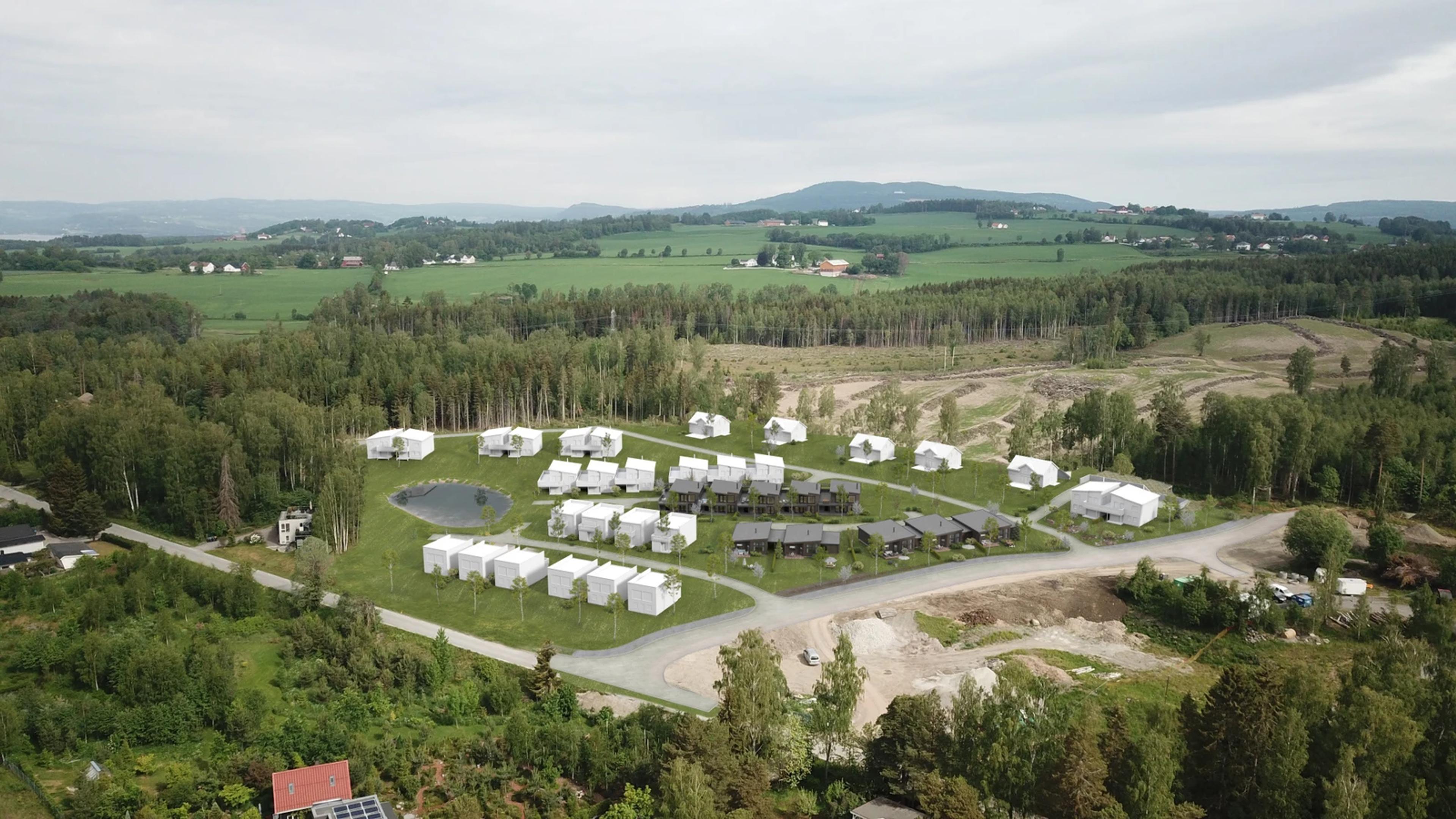 boligfelt med eneboliger og tomter med skog rundt