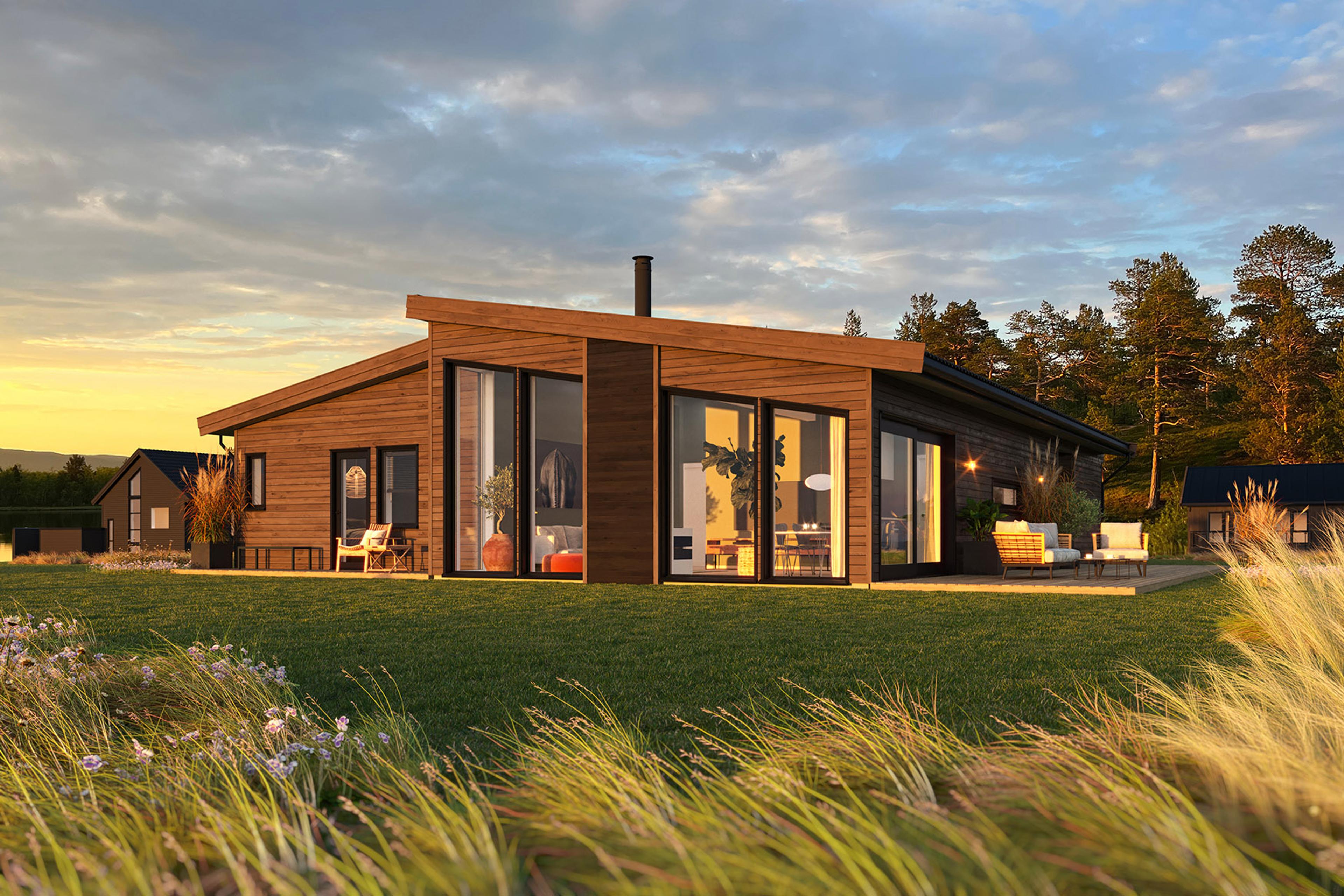 Viser et brunt hus med sorte detaljer. Huset er fra Nordbohus