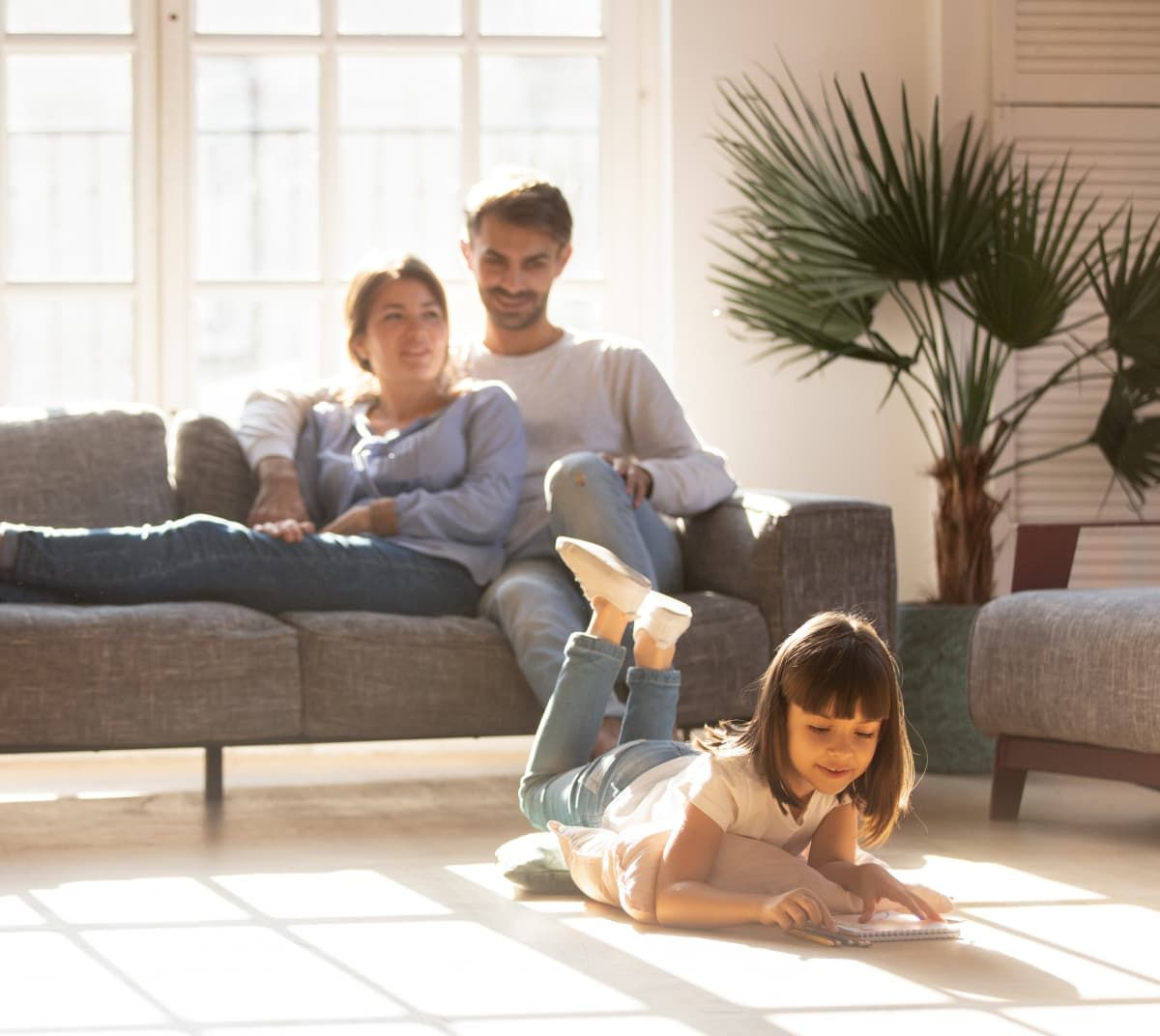 couple with daughter in the living room