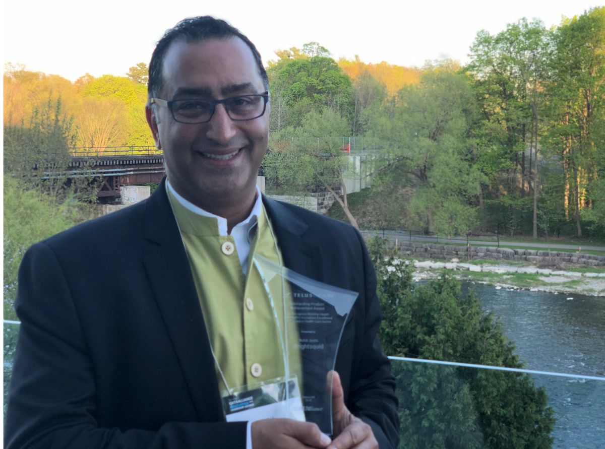 Rohit Joshi holding the Outstanding Product Achievement Award