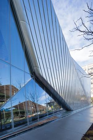 Detail view of the curtain wall and stainless steel cladding along the Oxford Street façade