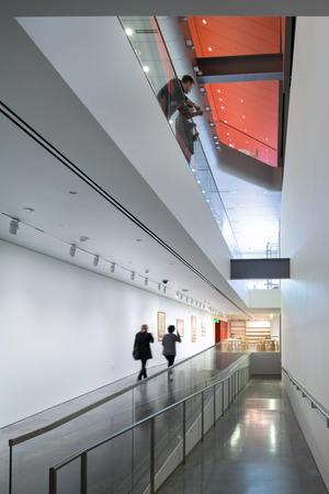 Main corridor on the lower level looking south, with view above to the second level