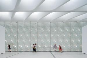 Third-floor galleries with skylights and interior veil