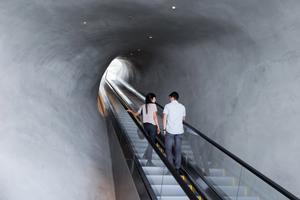 Escalator through the vault to galleries