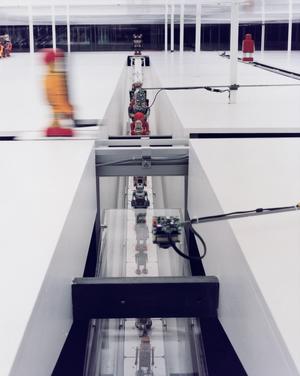 Robots on 300' conveyer belt
