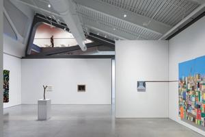 Large ground-floor gallery with view into the cafe above