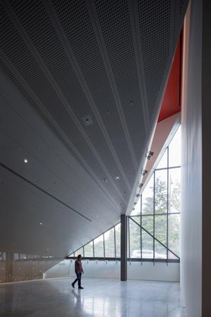 Interior view of the multipurpose event space and mezzanine, with the underside of the theater