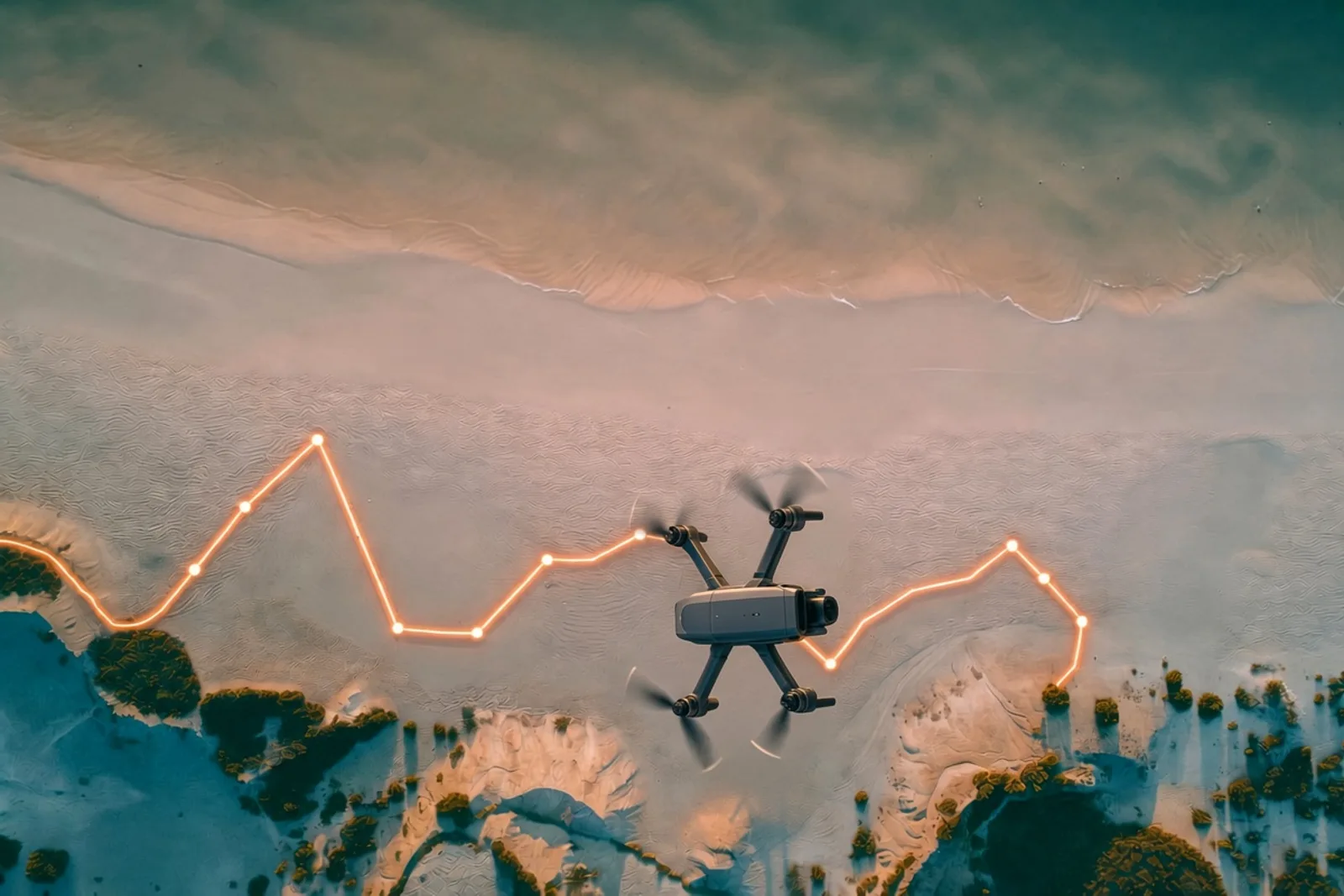 drone hovering over a beach