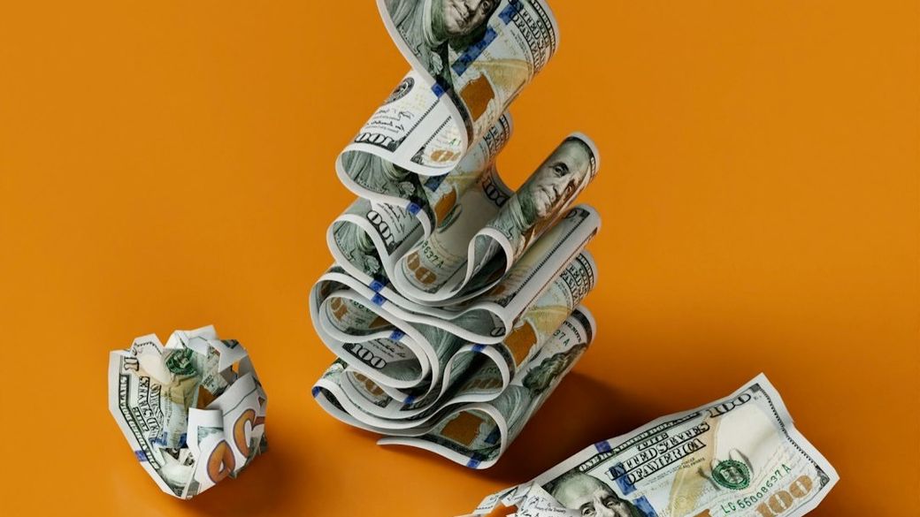 a stack of money sitting on top of a table — Credit: Photo by Igor Omilaev on Unsplash