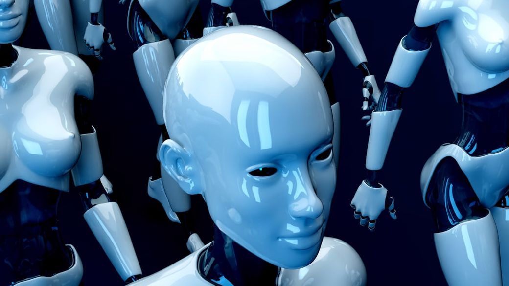 The image features a cluster of humanoid robots with a futuristic design, showcasing their smooth, glossy surfaces. The robots are depicted from various angles, emphasizing their advanced and sleek aesthetics. — Credit: Photo by julien Tromeur on Unsplash