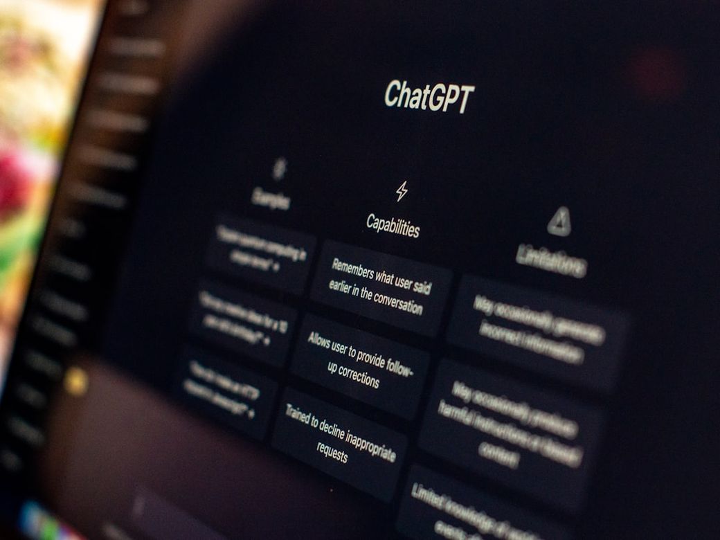 The image shows a close-up of a computer screen displaying the ChatGPT interface. Various options and features of the AI tool are highlighted, emphasizing its capabilities and limitations. — Credit: Photo by Emiliano Vittoriosi on Unsplash