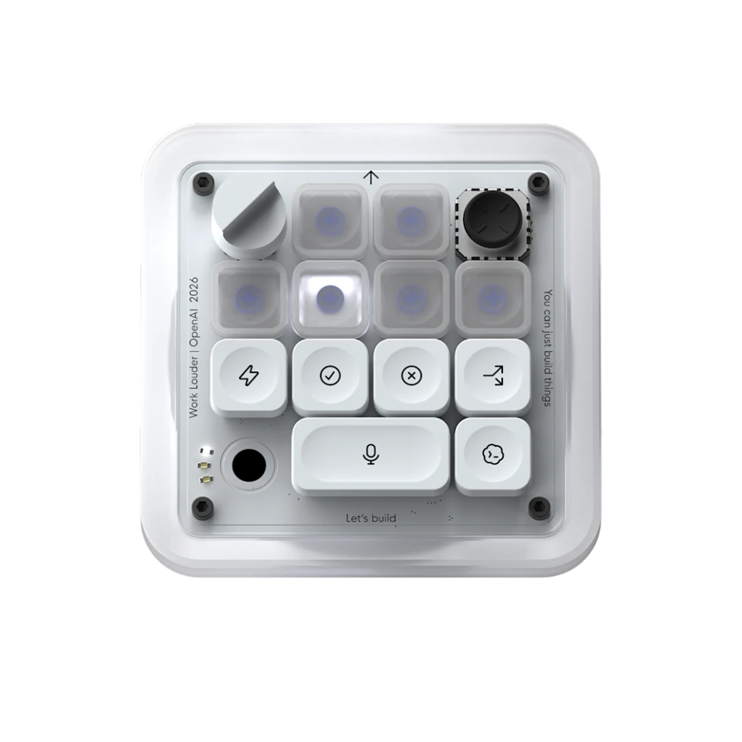The image shows a modern interface device featuring a grid of buttons and dials, designed for coding or technical use. It appears to be a micro controller or development kit, potentially related to OpenAI and its applications in programming or technology development.
