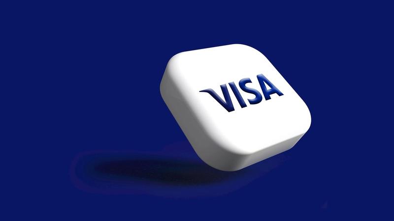 This image features a 3D rendering of a VISA logo on a solid blue background. The logo appears to be modern and clean, emphasizing brand recognition.