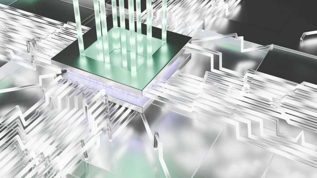 The image showcases a futuristic circuit board with transparent and reflective elements, suggesting advanced technology. The intricate design features a central processor surrounded by flowing circuitry, depicting a high-tech environment. — Credit: Photo by Logan Voss / Unsplash