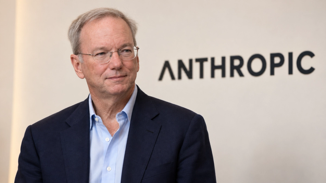The image features a middle-aged man wearing a navy blazer and light blue shirt, standing in front of a neutral background with the word 'ANTHROPIC' prominently displayed. This setting suggests a corporate environment, possibly related to technology or artificial intelligence, reflecting Eric Schmidt's connection to innovation in these fields.