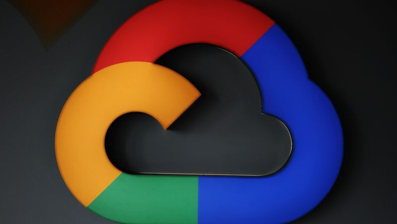 The image features a stylized logo of Google Cloud, represented in a colorful design. The logo is set against a dark background, highlighting its vibrant colors.