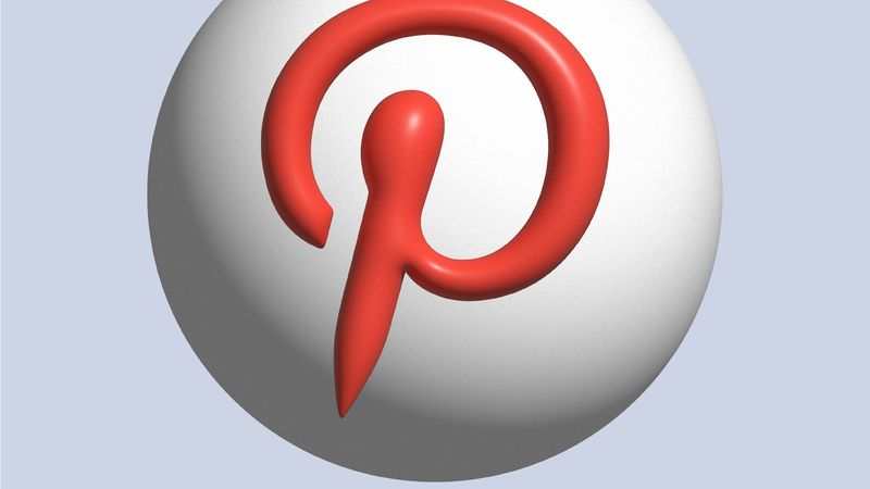 This image features a stylized version of the Pinterest logo prominently displayed on a spherical surface. The logo is depicted in red against a white background, emphasizing its distinctive design.