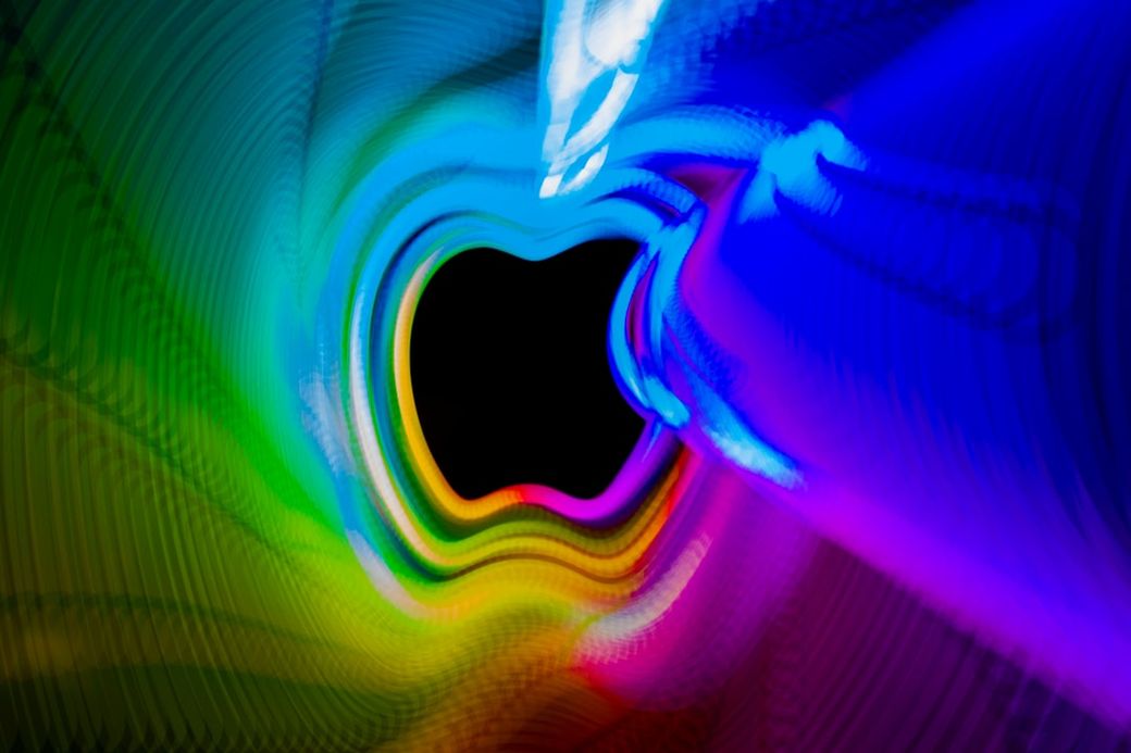 The image features vibrant, swirling colors creating a tunnel-like effect with a dark center. The movement and gradients suggest a dynamic and visually stimulating scene. — Credit: Photo by Nimrah Awais on Unsplash
