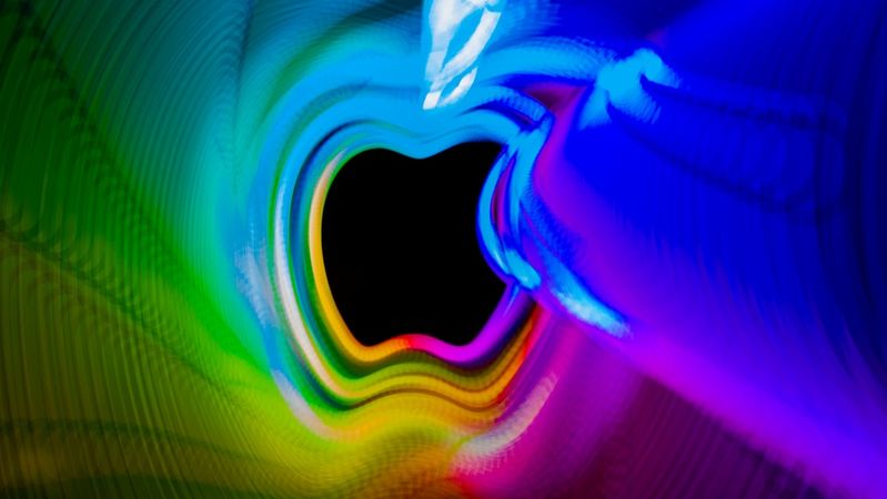 The image features vibrant, swirling colors creating a tunnel-like effect with a dark center. The movement and gradients suggest a dynamic and visually stimulating scene.
