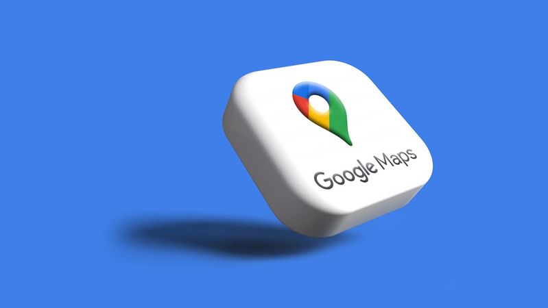 This image features a 3D representation of the Google Maps logo set against a solid blue background. The logo is prominently displayed with its recognizable pin and color scheme, emphasizing the location-based service offered by Google.
