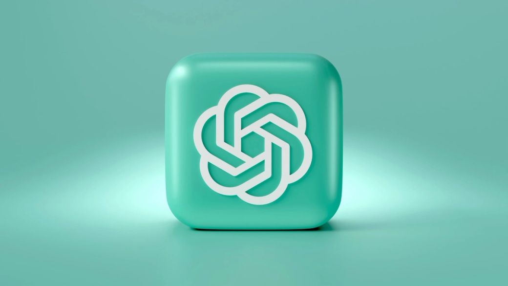 The image features a three-dimensional cube with a smooth, turquoise surface. The cube is embossed with a white, stylized logo that resembles an interlocking design, suggesting a modern technological theme. — Credit: Photo by Mariia Shalabaieva / Unsplash