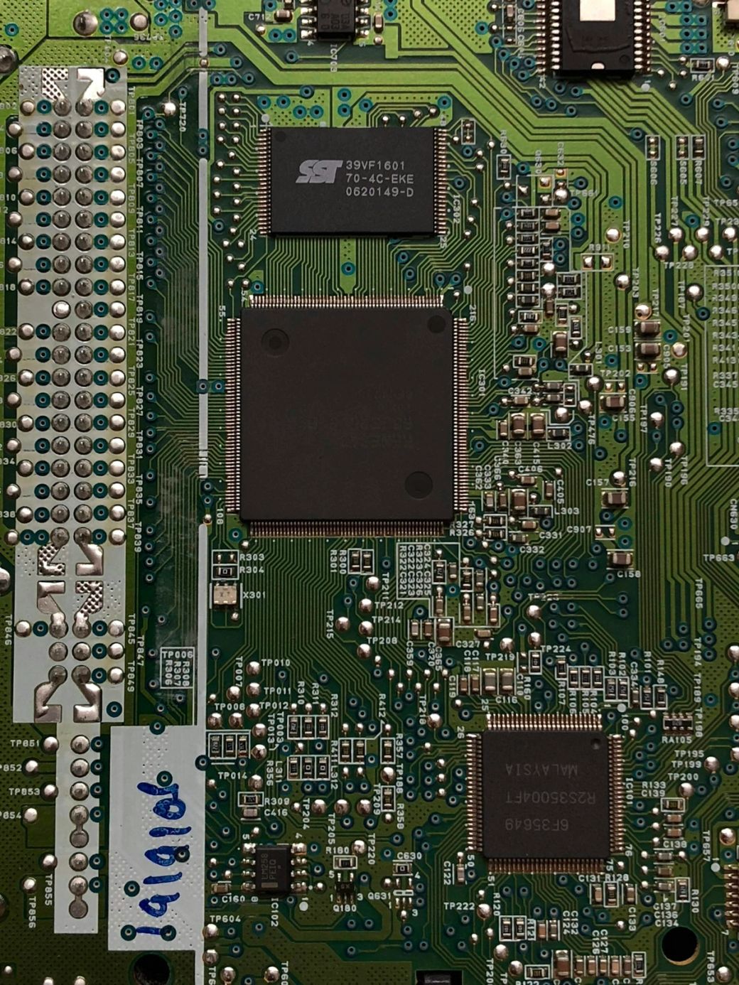 The image features a close-up view of a circuit board, showcasing various electronic components and intricate pathways. The central focus is on two prominent black chips with engraved text surrounded by smaller circuitry elements. — Credit: Photo by alerkiv / Unsplash