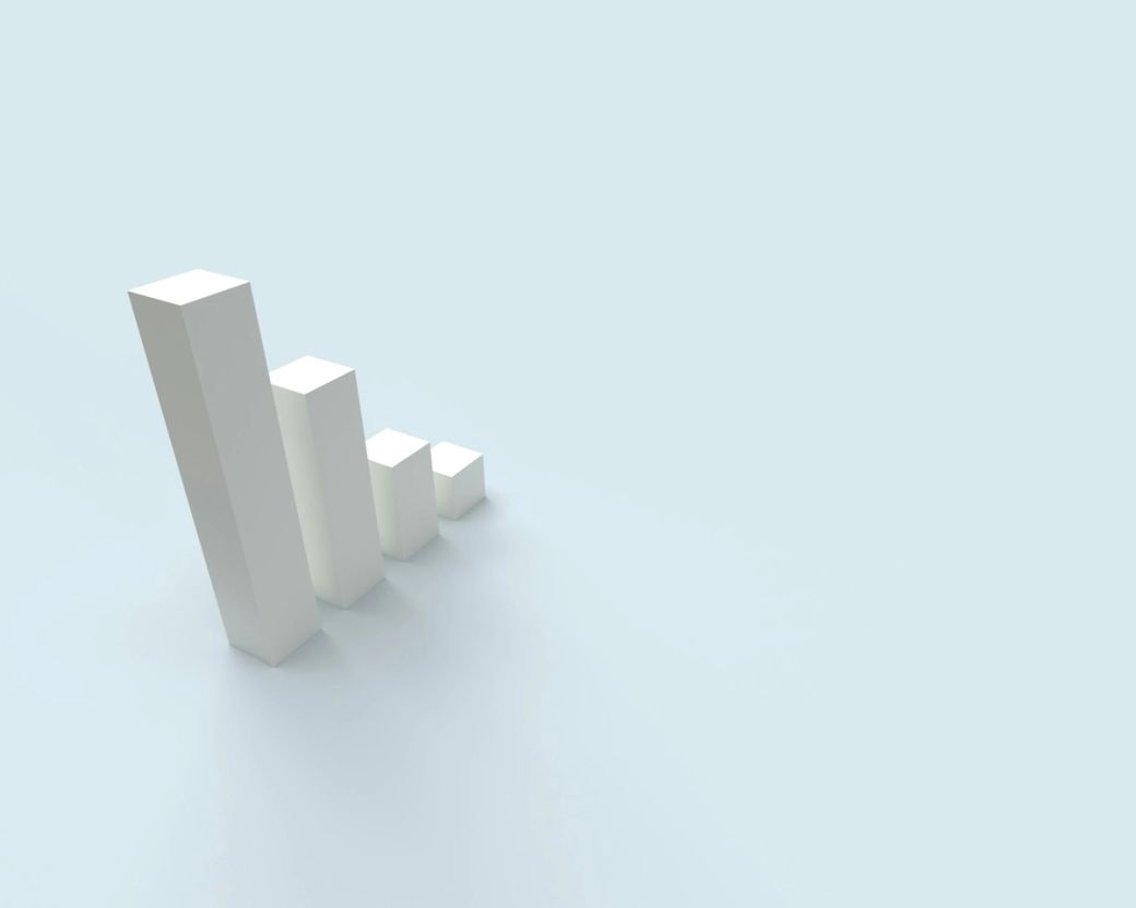 The image features a series of ascending white bars representing growth or increasing metrics, set against a light blue background. The visual suggests themes of progress and advancement. — Credit: Photo by Алекс Арцибашев / Unsplash